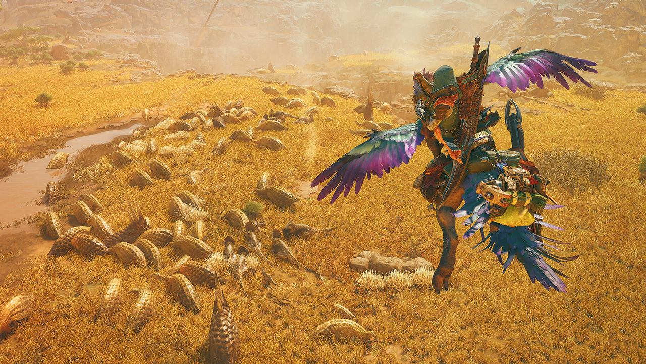 A hunter rides a feathered mount across golden grassland